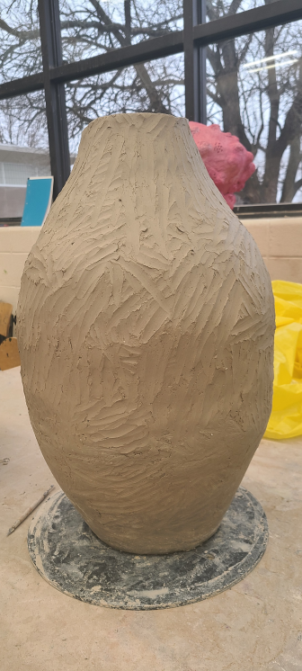 Starting the top half of the clay pot.